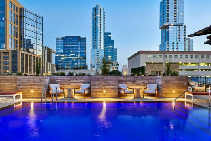 The swimming pool at the Canopy by Hilton Austin Downtown, one of the hotels near Austin Amtrak Station.