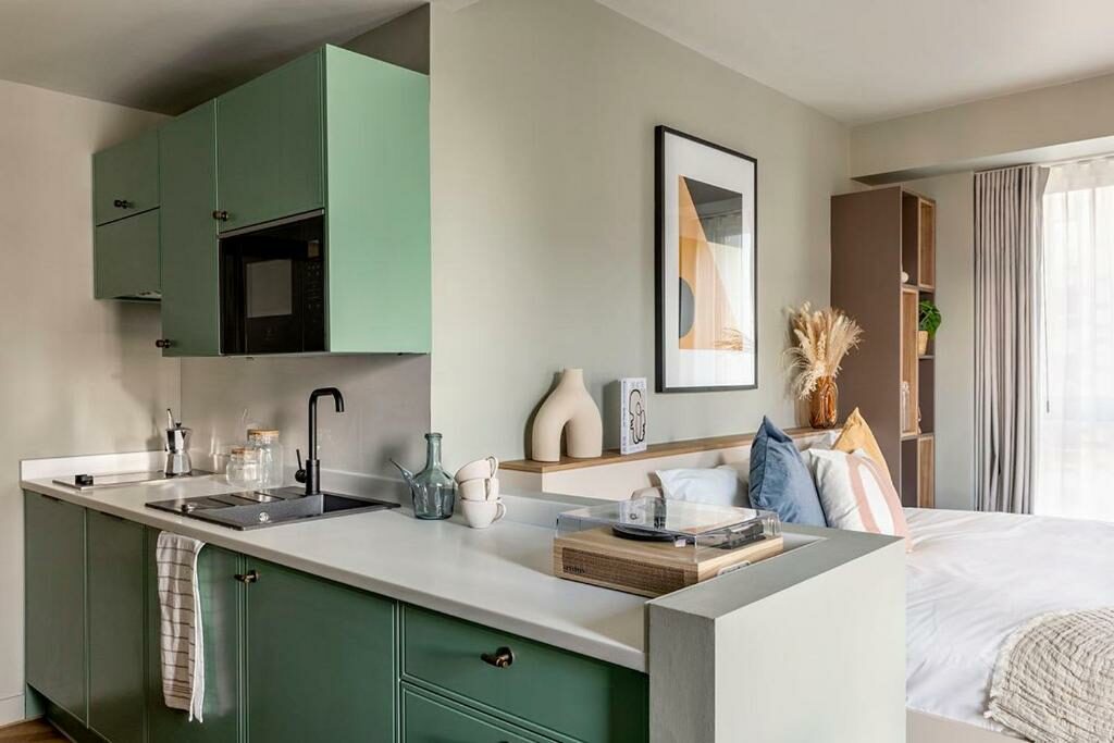 A deluxe studio with a kitchen at Wembley ARK Coliving.