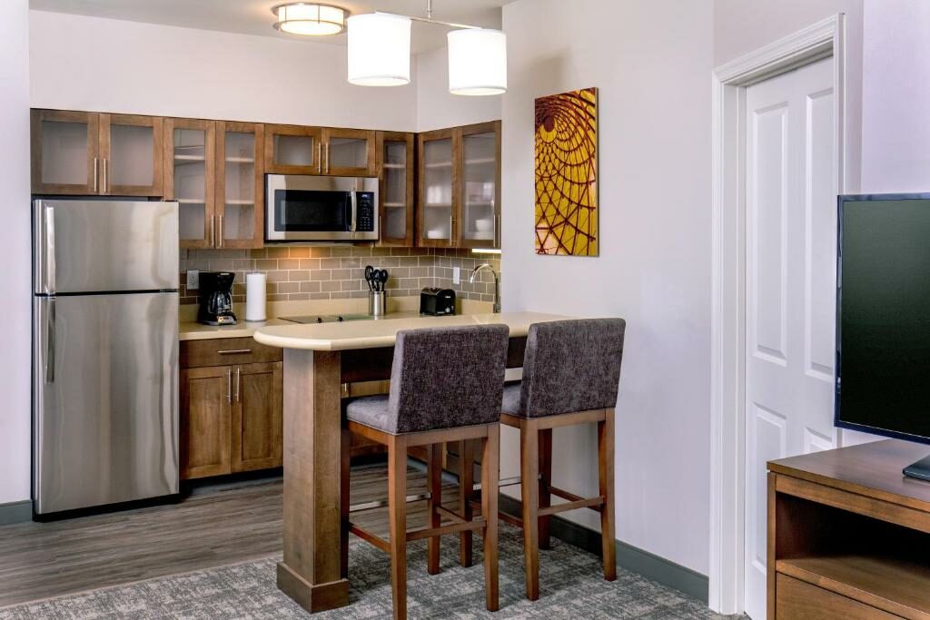 A room with a kitchen at Staybridge Suites Charlottesville Airport.