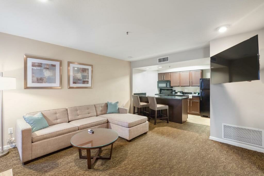 A room with a kitchen at the Chase Suites Brea - Fullerton - North Orange County.