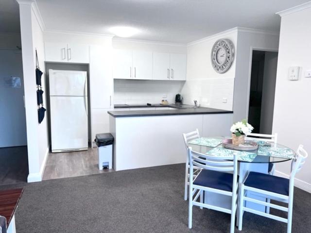 An apartment with a kitchen at the River Plaza Apartments.