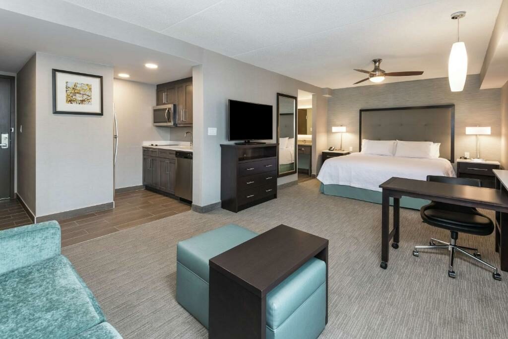 A spacious room with a kitchen at the Homewood Suites Ottawa Airport.