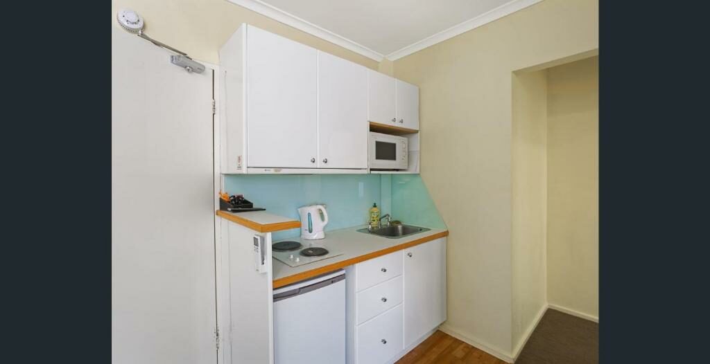 A kitchenette at the Knightsbridge Apartments.