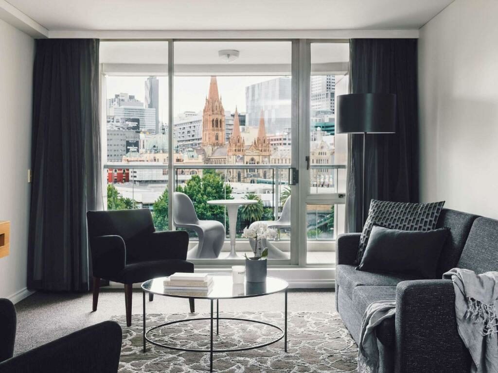 An apartment with a balcony at the Quay West Suites Melbourne.